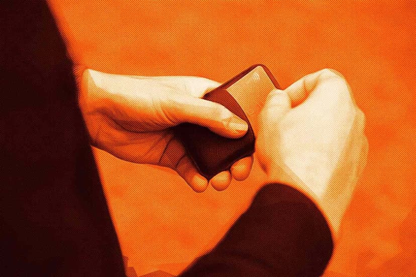 man retreiving debit card out of wallet